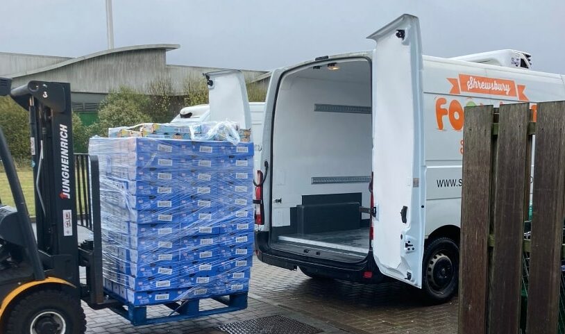 Our neighbours come to the rescue with their forklift to help us unload pallets of food | Shrewsbury Food Hub